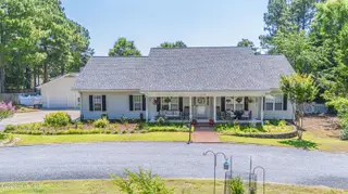 114 Bellhaven Drive, Whispering Pines, NC 28327 – photo 1: DJI_20260611120207_0015_D