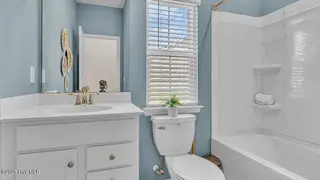 8667 Baton Rouge Avenue NW, Calabash, NC 28467 – photo 15: crs_1946_pic_stphillips_bath2_f1