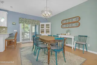409 Womble Street, Oak Island, NC 28465 – photo 13: Sliding Doors to Back Screen Porch