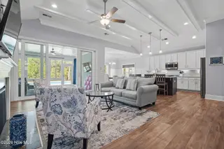 6476 Bryson Drive SW, Ocean Isle Beach, NC 28469 – photo 7: Open concept/vaulted ceiling/beams