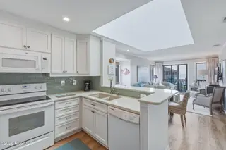2111 W Fort Macon Road 313 Dunescape, Atlantic Beach, NC 28512 – photo 5: Kitchen with bar seating