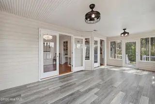 1281 Spring Lake Drive, Southport, NC 28461 — 3-bedroom home, Southport, NC, photo 24 of 46: Enclosed Back Porch – Lake Views