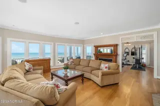 3107 Ocean Drive, Emerald Isle, NC 28594 – photo 4: Open living room w/ fireplace