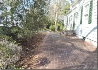 2856a Forest Hills Loop SW, Wilson, NC 27893 – photo 18: 18 _ Brick Patio on Lake Side of Home