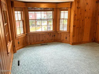 1902 Trent Boulevard, New Bern, NC 28560 – photo 11: Cozy wood-paneled room with bay window
