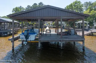 2313 Waccamaw Shores Road, Lake Waccamaw, NC 28450 – photo 14: Spacious Pier - with boat lift