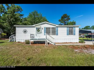 6883 Eastbrook Avenue SW, Ocean Isle Beach, NC 28469 — 2-bedroom manufactured home in Pine Acres, Ocean Isle Beach, NC, photo 5 of 25: Front