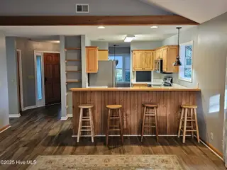 3235 Marsh View Drive SW, Supply, NC 28462 — 3-bedroom home in Lockwood Folly, Supply, NC, photo 7 of 36: Living to Kitchen