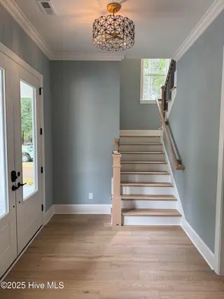 209 Coastal Dune Court, Wilmington, NC 28412 — 3-bedroom home in Riverlights, Wilmington, NC, photo 6 of 27: Brookshire Foyer and Stairs