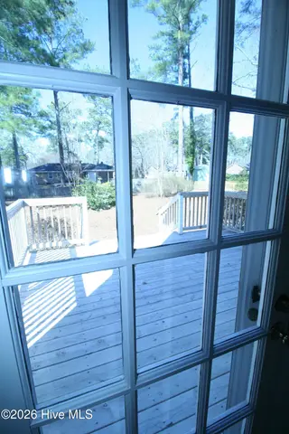 1313 Rondo Drive, Greenville, NC 27858 – photo 17: Patio Door onto Rear Deck from Formal Li