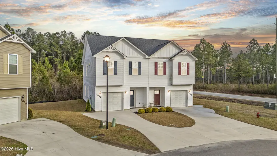 2041 Folkstone Woods Lane 10a, Holly Ridge, NC 28445 – photo 1 of 44: 1_virtual twilight