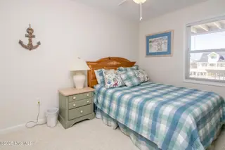 1131 S Shore Drive, Surf City, NC 28445 – photo 14: Poolside South Queen Bedroom