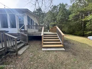 691 Harris Creek Road, Jacksonville, NC 28540 — 3-bedroom home, Jacksonville, NC, photo 10 of 41: backyard and deck