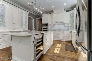 3508 Concordia Avenue SW, Supply, NC 28462 – photo 16: Kitchen Island with Wine Cooler