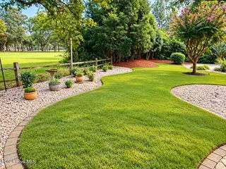 301 Wisteria Way, Caswell Beach, NC 28465 – photo 1: Back Yard