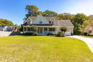 165 Cedar Lane, Newport, NC 28570 — 3-bedroom home in Gull Harbor, Newport, NC, photo 1 of 48: Front Exterior & Spacious Lawn