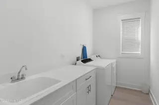 320 Summerhouse Drive, Holly Ridge, NC 28445 — 5-bedroom home in Summerhouse On Everett Bay, Holly Ridge, NC, photo 23 of 41: laundry