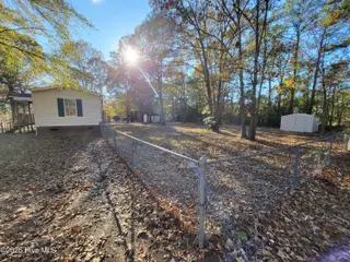 119 Edgewater Lane, Richlands, NC 28574 — 2-bedroom manufactured home in Chapel Ridge, Richlands, NC, photo 7 of 34: Fenced Backyard