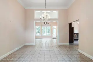 86 Plantation Passage Drive SE, Bolivia, NC 28422 — 4-bedroom home in Winding River Plantation, Bolivia, NC, photo 5 of 77: Dining Room