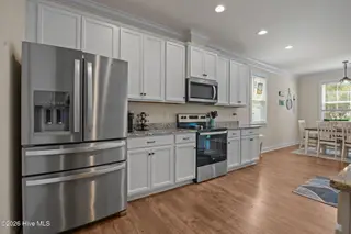 129 NW 11th Street, Oak Island, NC 28465 – photo 14: kitchen-dining