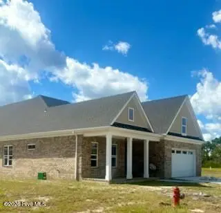 706(Lot29) Orly Lane, Wilmington, NC 28412 — 4-bedroom home in Village at Motts Landing, Wilmington, NC, photo 2 of 19: 706 Orly side