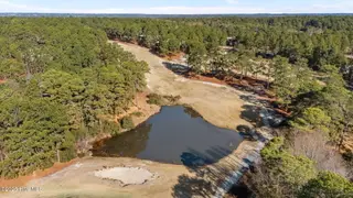 31 Cardinal Drive, Whispering Pines, NC 28327 – photo 9: aerial pond