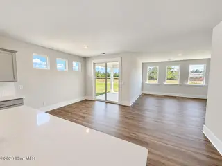 8615 Blue Haw Way Lot 125, Leland, NC 28451 — 3-bedroom home in Indigo Preserve, Leland, NC, photo 13 of 41: Open Living Area