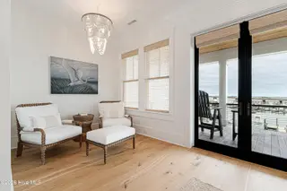 216 Radio Island Road, Morehead City, NC 28557 — 4-bedroom home in Tide Lines, Morehead City, NC, photo 23 of 56: Primary Sitting Area w/ Water Views