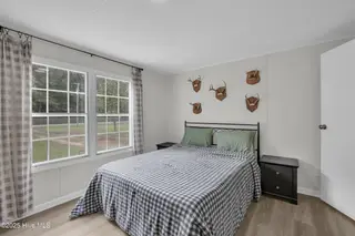 2216 Bell Williams Road, Burgaw, NC 28425 — 3-bedroom manufactured home, Burgaw, NC, photo 9 of 25: Primary Bedroom – Comfortable Retreat