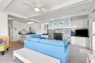 2801 Pier Pointe Drive B2, Emerald Isle, NC 28594 – photo 8: Living Room with Wet Bar and Builtins