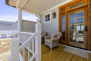 125 Roosevelt Drive, Pine Knoll Shores, NC 28512 — 5-bedroom home in Roosevelt Beach, Pine Knoll Shores, NC, photo 13 of 61: Covered front porch