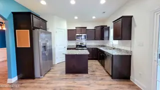 2007 Snapper Street, New Bern, NC 28562 — 4-bedroom home in Bluewater Rise, New Bern, NC, photo 9 of 31: 9 View of Kitchen from Living Room