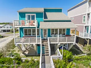 1123 E Beach Drive, Oak Island, NC 28465 – photo 2: mls-DJI_20250428105444_0110_D