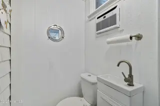 3617 W Pelican Drive, Oak Island, NC 28465 – photo 20: 15_outdoor bathroom