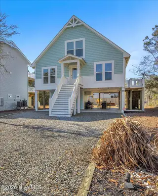 129 N Middleton Avenue, Oak Island, NC 28465 – photo 3: 67-Final 129 N Middleton Ave-RJREM-4341
