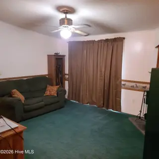 107 Eagle Ridge Drive, Dudley, NC 28333 — 4-bedroom manufactured home in Eagle Ridge, Dudley, NC, photo 10 of 17: Den 2
