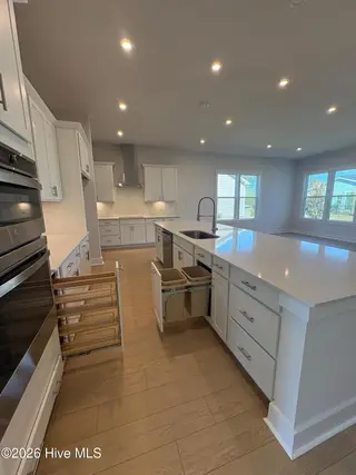2024 Oakton Drive 15, Southport, NC 28461 – photo 12: Spice Rack & Trash Can Drawer