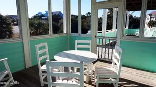 201 Shipwreck Lane, Emerald Isle, NC 28594 – photo 2: Screen porch off living room facing the