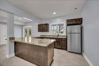 227 Gazebo Court, Wilmington, NC 28409 — 6-bedroom home in Inlet Point Harbor, Wilmington, NC, photo 9 of 67: First-Floor Great Room/In-Law Suite