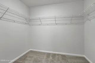 1129 Tennessee Walker Way, Bolivia, NC 28422 — 4-bedroom home in River Tide Farms, Bolivia, NC, photo 12 of 18: Primary Closet