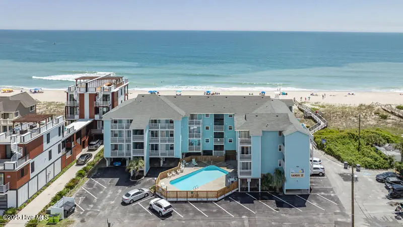 1423 Lake Park Boulevard S Unit 1a, Carolina Beach, NC 28428 – photo 1 of 23: sands v air $$ building front