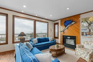 111 Dogwood Circle, Pine Knoll Shores, NC 28512 – photo 19: Living room with fireplace