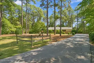 55 Birdie Drive, Whispering Pines, NC 28327 – photo 2: set back from road