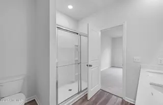 208 Ocean Pointe Boulevard SE 5301, Bolivia, NC 28422 – photo 6: SC-CXT - IN- Owner's Walk-In Shower- Ibi