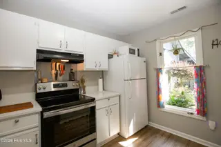 171 Cranes Cove, Vass, NC 28394 – photo 18: 56_Kitchen-Cabinets-Range-Refrigerator_1