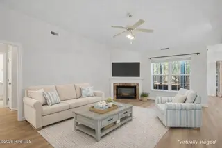 3803 Harmony Circle SE, Southport, NC 28461 – photo 10: virtually staged living room