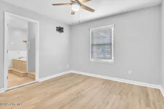 127 NW 19th Street, Oak Island, NC 28465 – photo 17: Primary Bedroom with ensuite