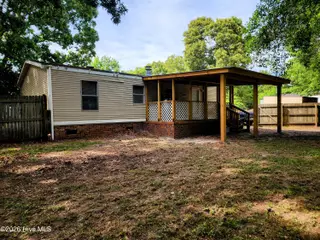 623 Sandy Bluff Drive SW, Supply, NC 28462 — 3-bedroom manufactured home in Sandy Bluff, Supply, NC, photo 19 of 26: Covered Back Porch