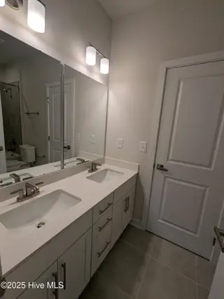 1276 Piper Glen Drive, Sunset Beach, NC 28468 – photo 12: Bathroom