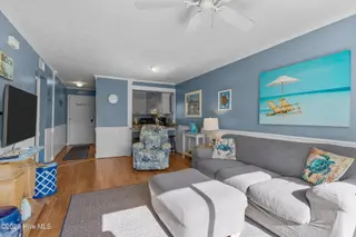 1000 Caswell Beach Road Apt. 806, Oak Island, NC 28465 — 2-bedroom condo in Oak Island Bch Villa, Oak Island, NC, photo 24 of 56: Living and Dining Area